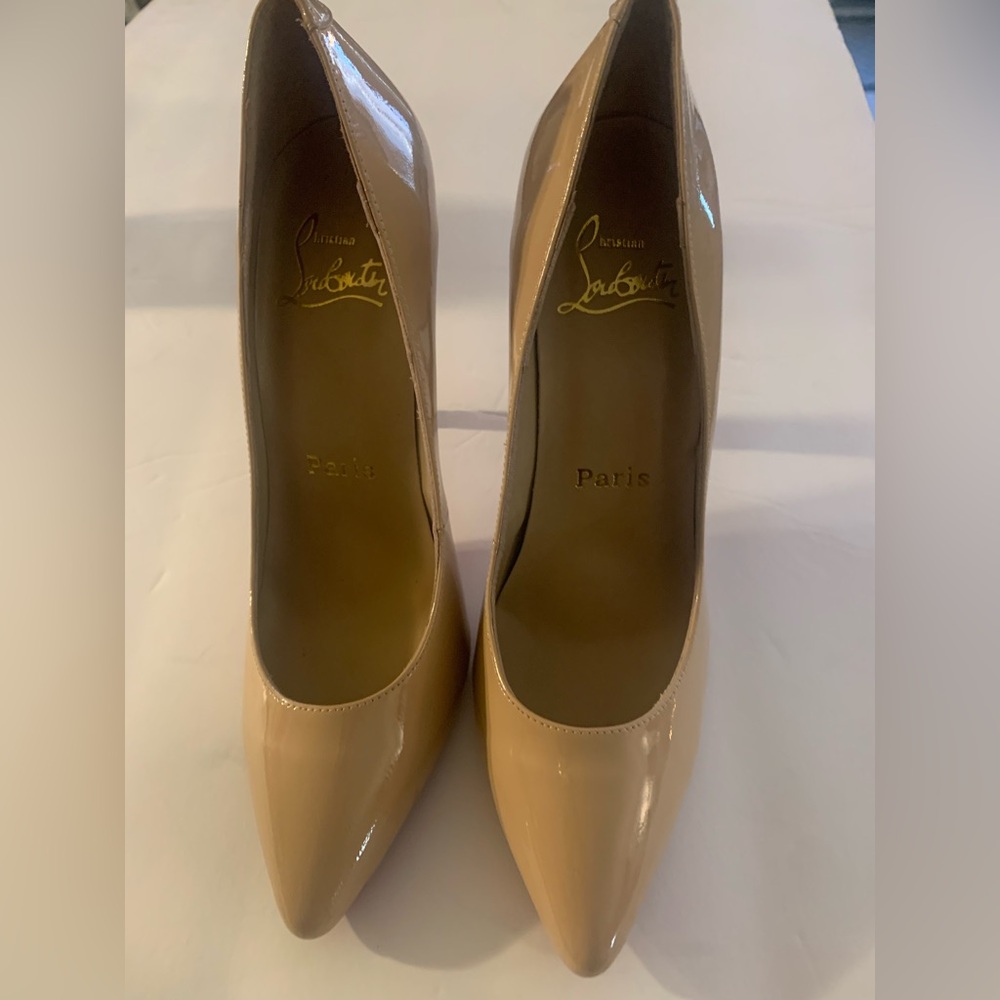 Size 7.5 Christian Louboutin. Nude. Like new.